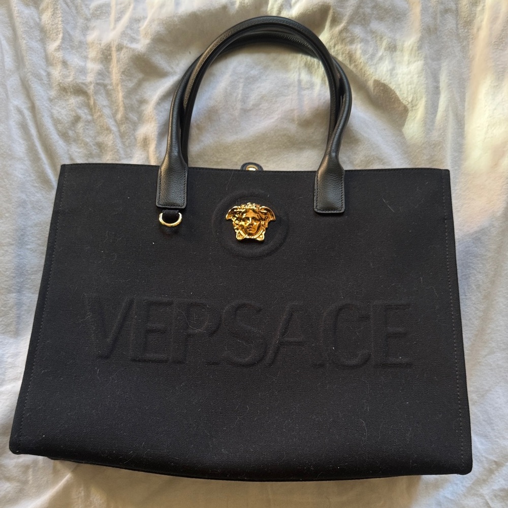 Versace Black Tote with Gold Medusa 
Never actually used. Lint is removable